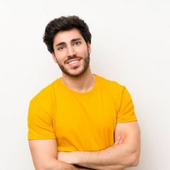 handsome-isolated-white-wall-laughing_1368-48310